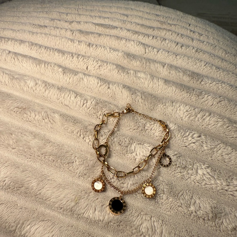 Elegant laminate Gold and Black Charm Bracelet